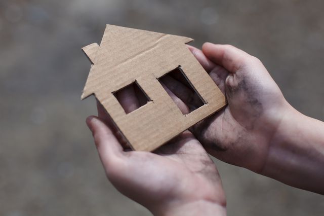 A stock image of a cardboard cut out of a house.